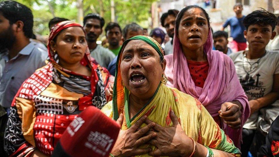 A resident breaks down during the anti-encroachment drive carried out by the Municipal Corporation of Delhi in Jahangirpuri