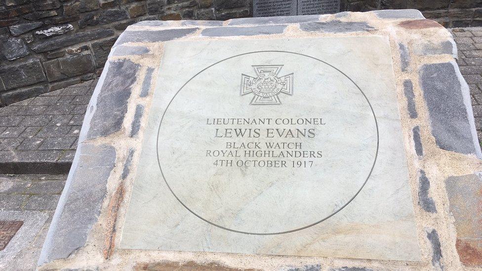 Close-up of stone dedicated to Gen Evans