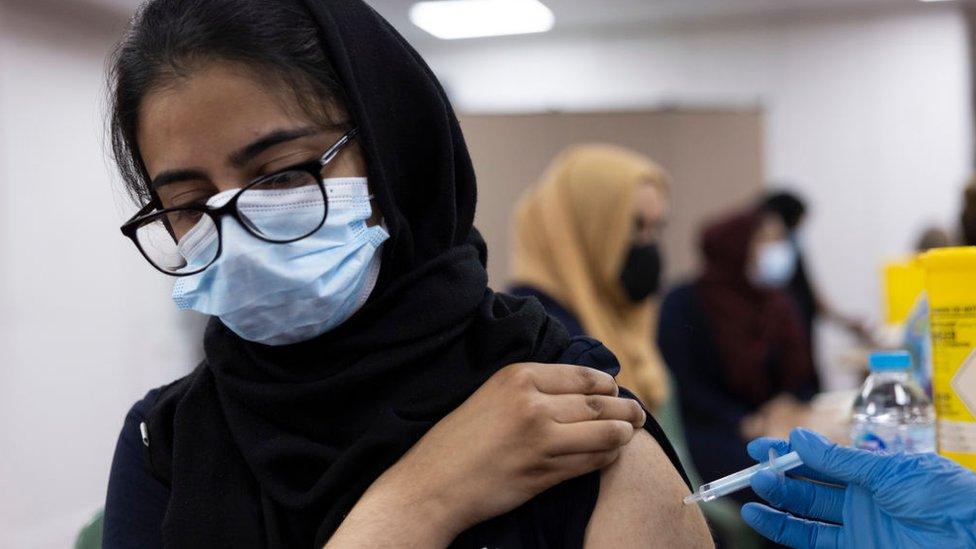 Members of public have their Covid-19 vaccine at Fazl mosque in Southfields