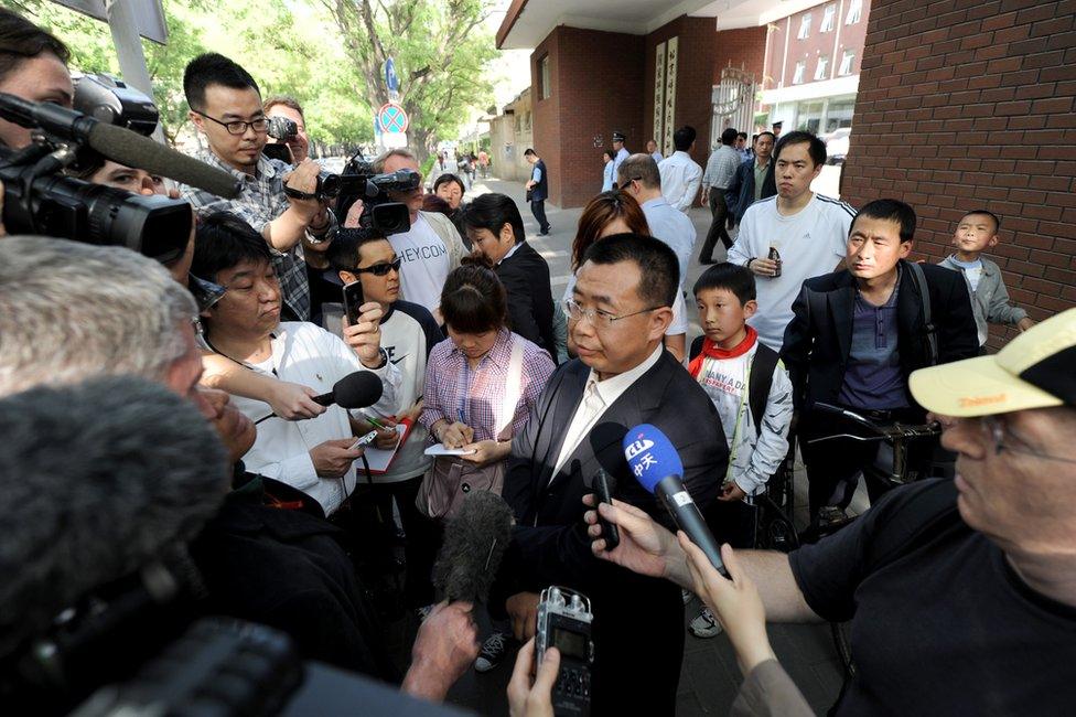 Journalists interview Chinese rights lawyer Jiang Tianyong in Beijing in May 2012.