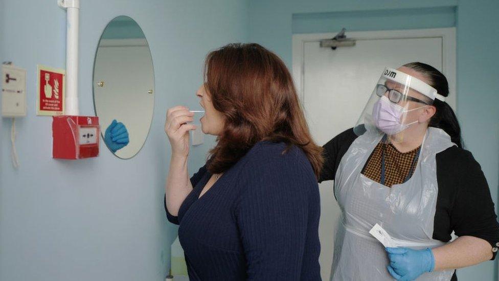 Woman taking a covid test in a care home