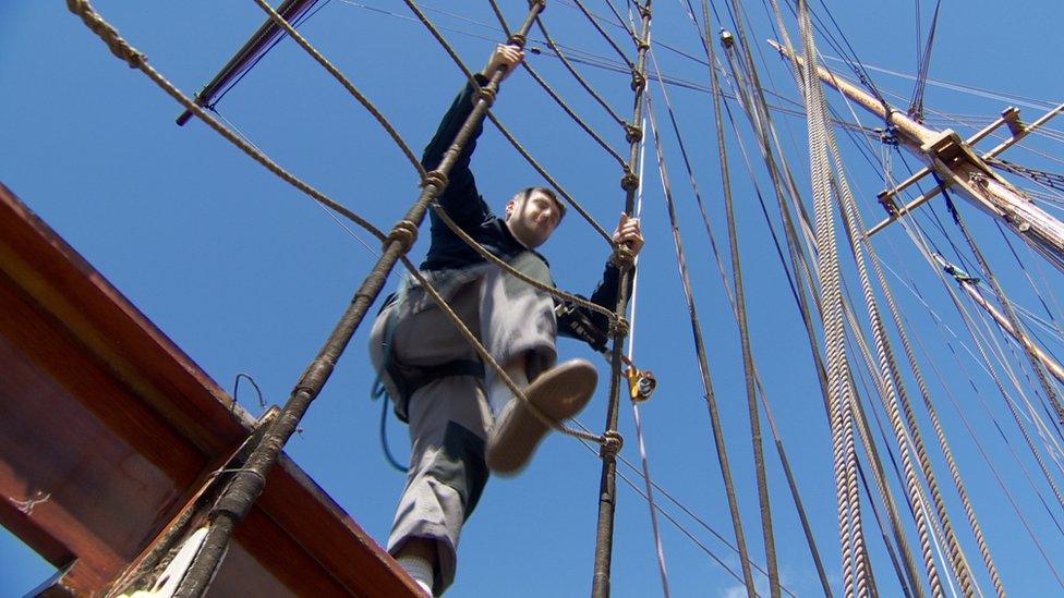 A man climbing the rig