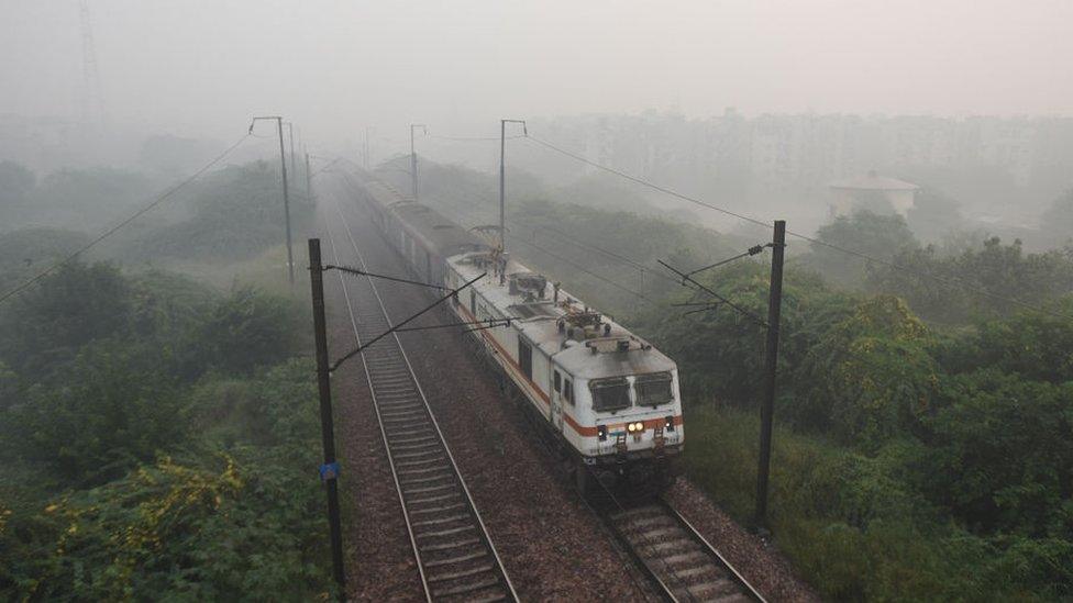 a train in the smog.