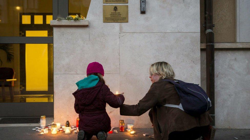 Candles lit outside Belgian Embassy in Budapest, Hungary, Tuesday, March 22, 2016