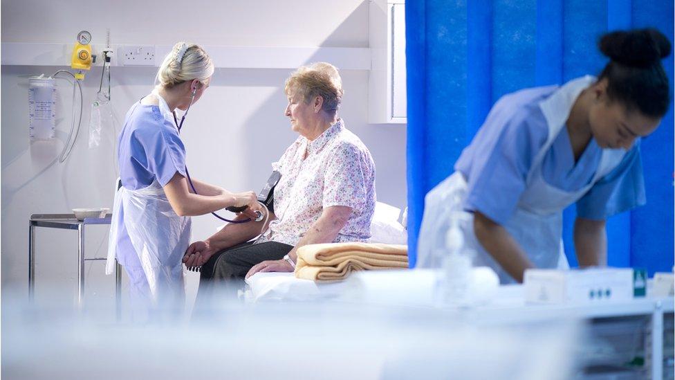 patient having blood pressure checked in A&E