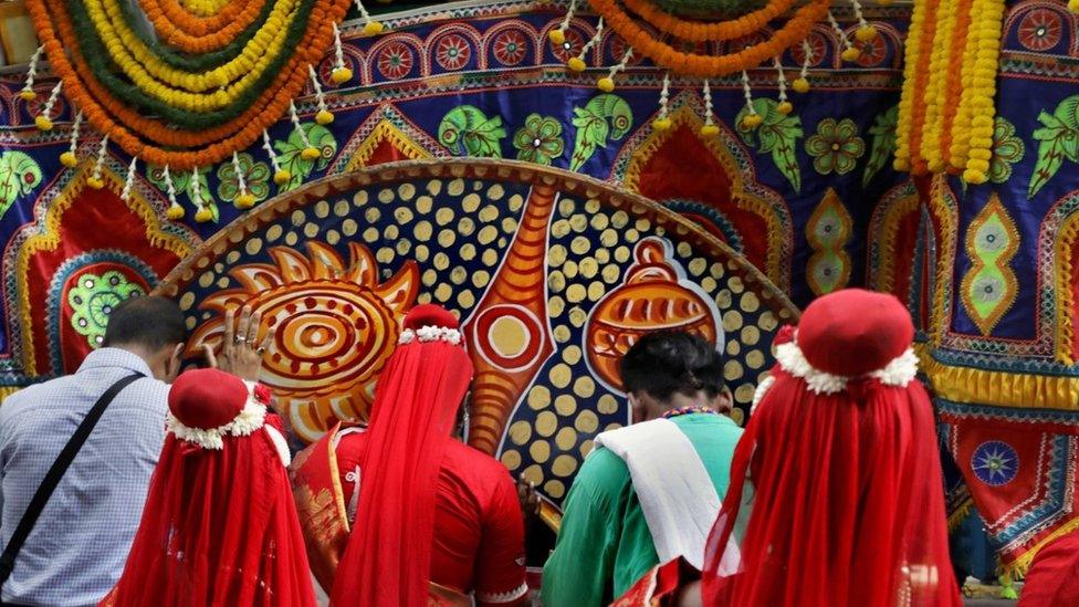 Worshippers greet a holy chariot during the chariot festival