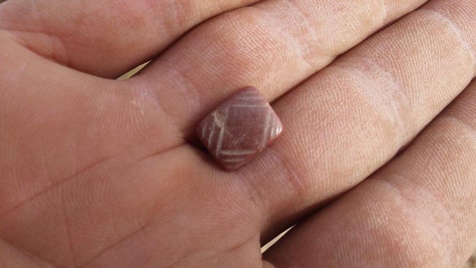 A seal made of carnelian stone found in the cave