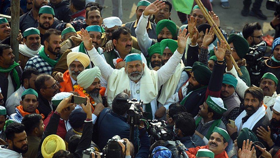 Farmer Leader Rakesh Tikait celebrates with farmers at the Ghazipur border on December 15, 2021 in Delhi after PM Modi rolled back controversial farm laws