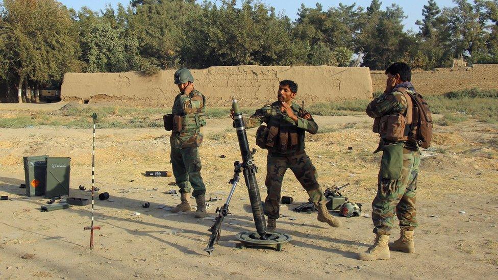 Afghan National Army (ANA) soldiers fire a mortar round at Taliban positions during a battle with Taliban in Kunduz province, Afghanistan October 8, 2016.