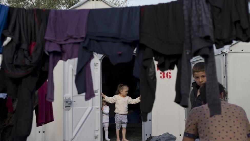 Children play among washing at the Kara Tepe camp in Greece