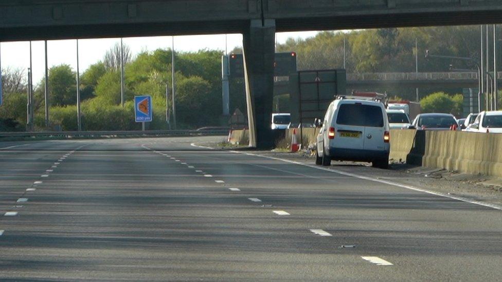 A van on the inside of the road