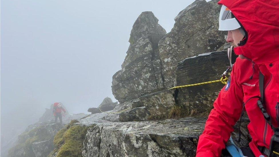 Rescuers on Sharp Edge