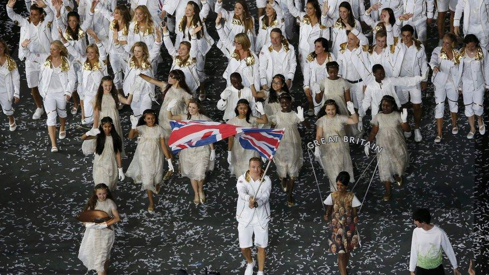 Flagbearer Sir Chris Hoy of Great Britain leads the Team GB contingent in the athletes parade during the opening ceremony of the London 2012 Olympic Games at the Olympic Stadium on July 27, 2012 in London,