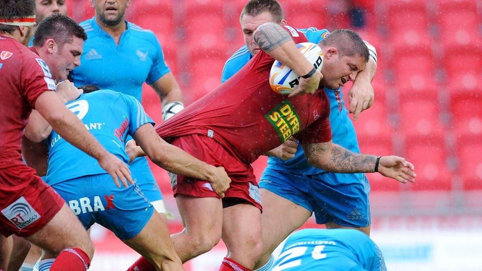 Rhys Thomas surges forward for the Scarlets in a Pro 12 match with Aironi Rugby in 2011