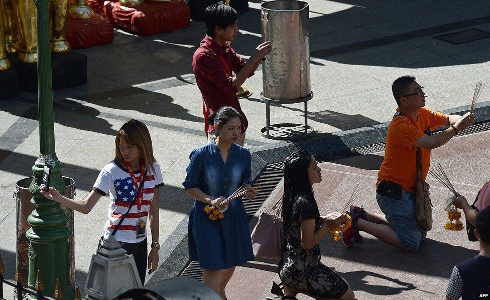 Visitors to the Erawan shrine