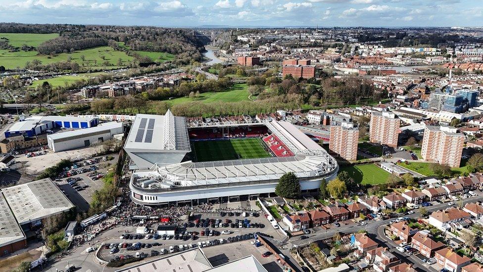 An aerial shot of Ashton Gate Stadium in Bristol with houses in Clifton in the background