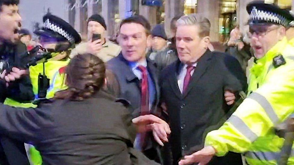 Sir Keir Starmer protected by police