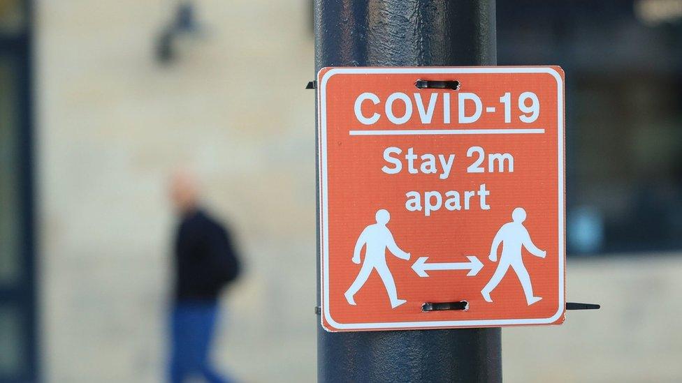 A "stay 2m apart" sign in Manchester