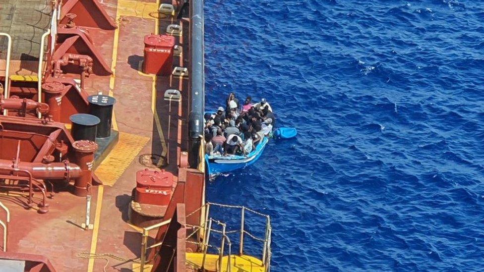 The Danish-flagged Maersk Etienne rescuing a group of migrants