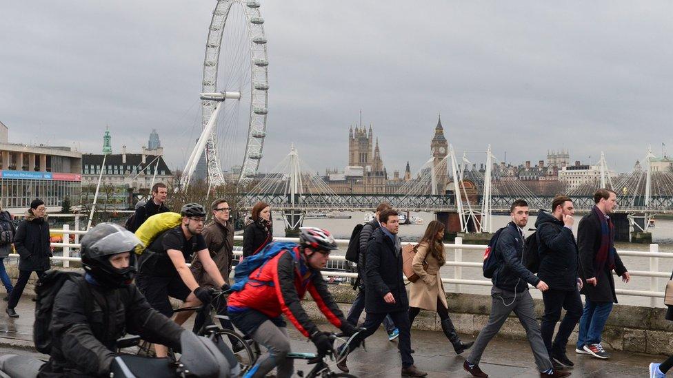 People walking and cycling across Waterloo Bridge on Monday morning