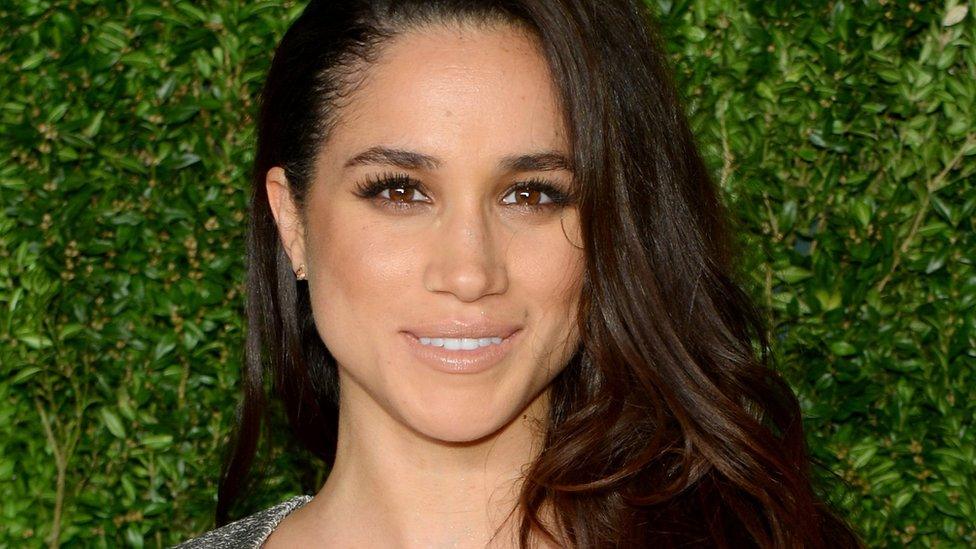 Meghan Markle posing at the Vogue Fashion Fund Awards in New York