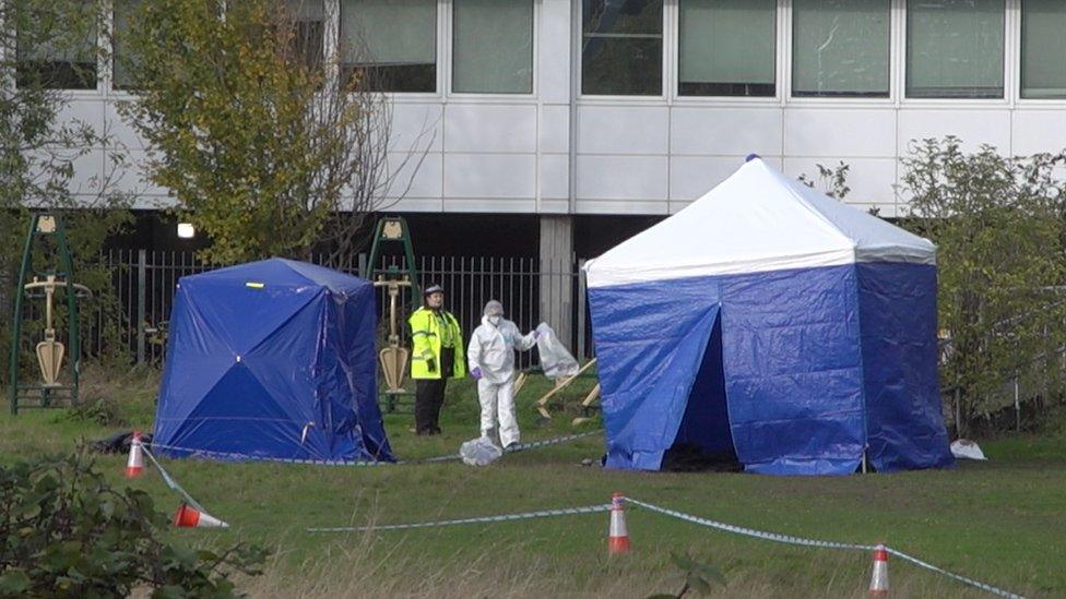 Police by the scene of a stabbing in Cambridge