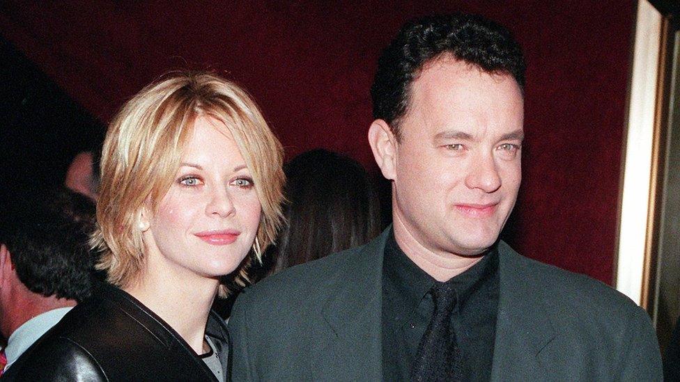 Meg Ryan and Tom Hanks pose for photographers at the premiere of 'You've Got Mail,' at the Ziegfeld Theatre 10 December 1998 in New York City