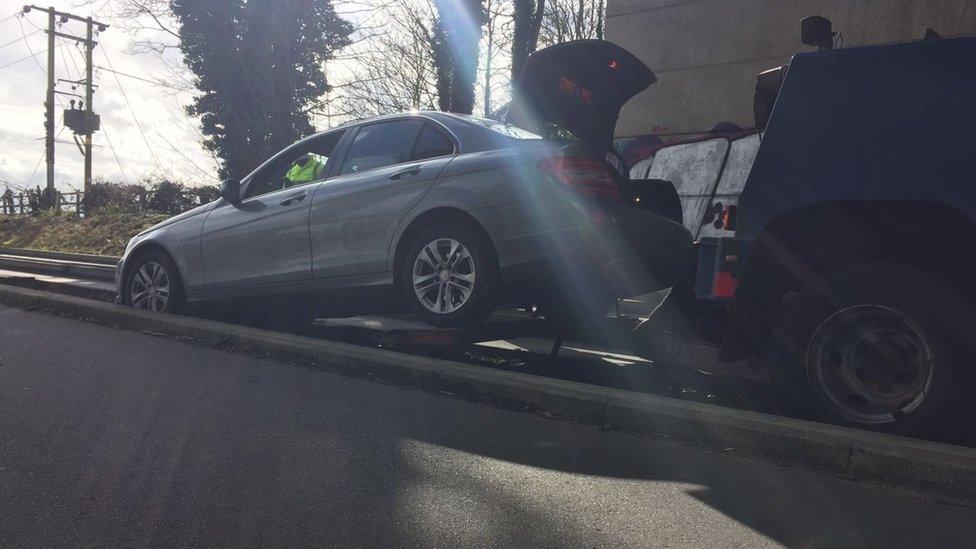 Car being removed by another vehicle