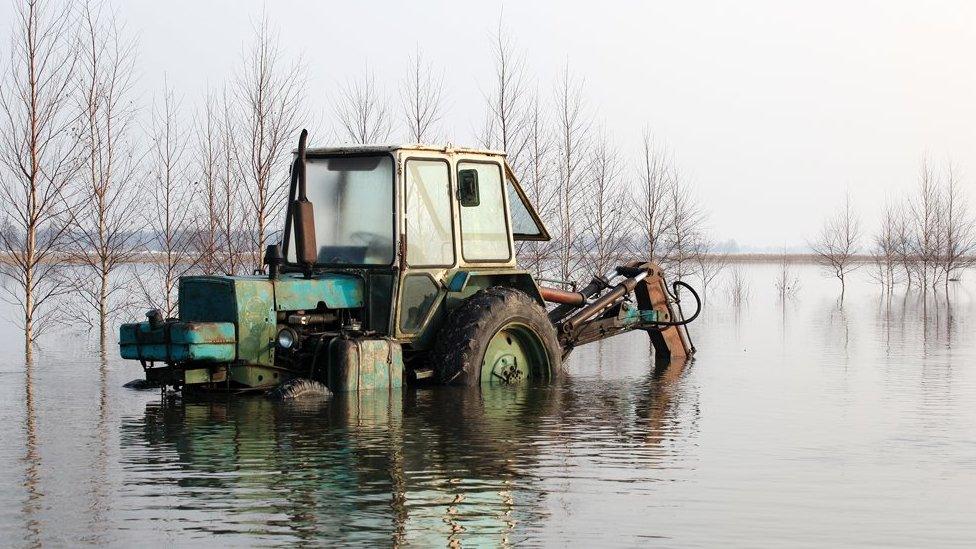 A tractor stuck in floodwater near Bungay, Suffolk