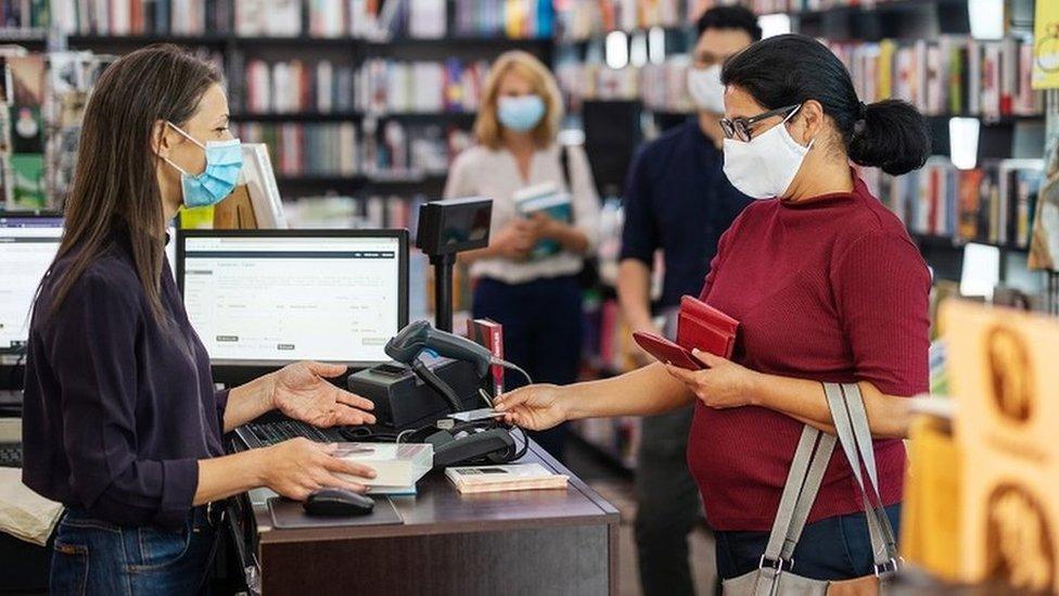 Book shop customers wearing face masks