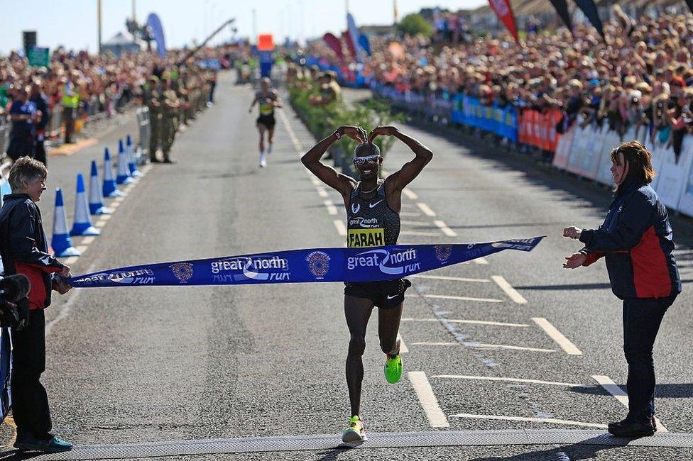 Mo Farah doing the Mobot as he crosses the finish line in South Shields in 2016