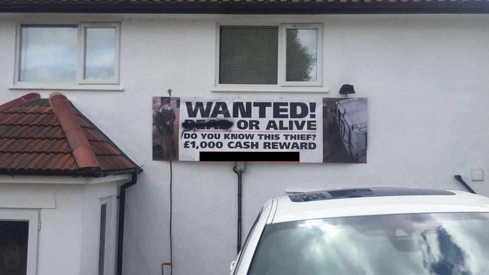 Wanted poster on side of Sebastian Stephenson's house