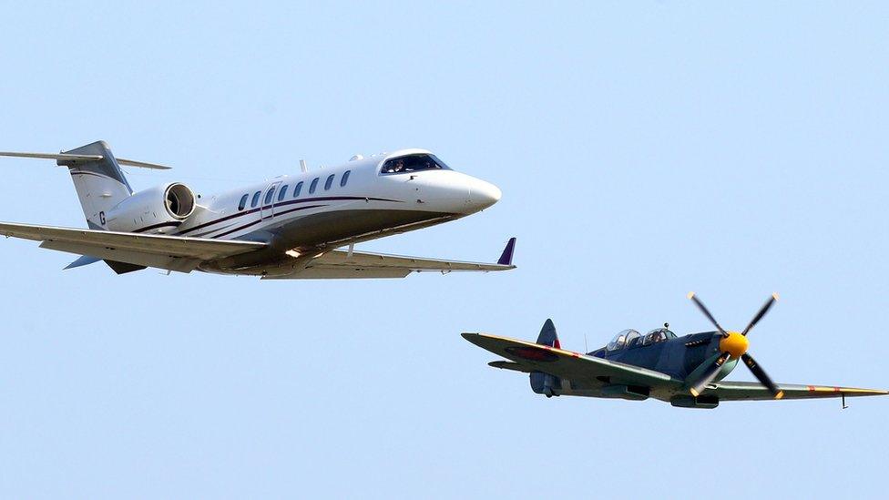 Learjet containing veterans (left) flies alongside a Spitfire carrying former pilot Ray Roberts