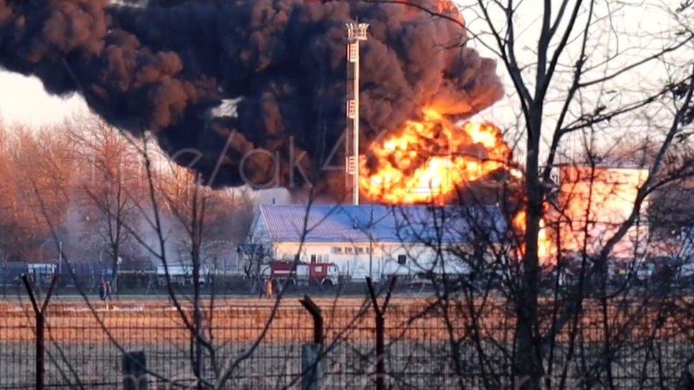 The fire at an airfield in Kursk was burning hours after an oil storage tank was blown up