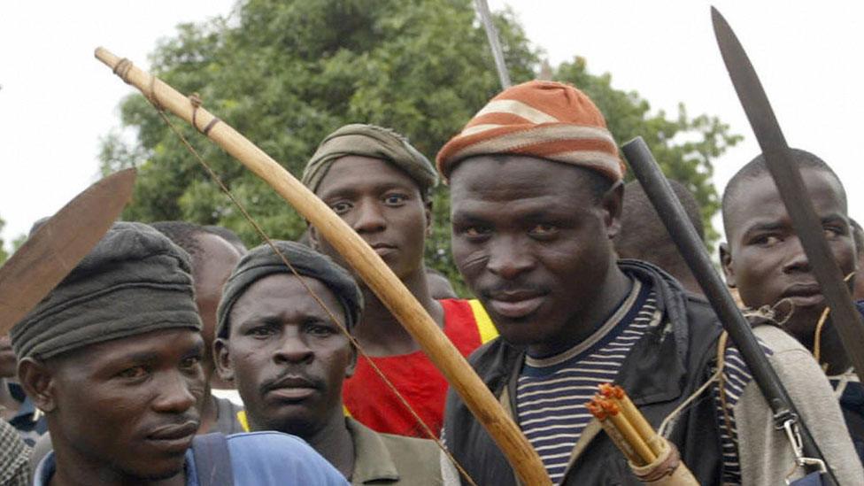 Angry youths of Bakin Ciyawa get ready to defend their town with their machetes, bows and arrows in absence of security operatives 21 May 2004, following attacks by Hausa Fulani herdsman at Bakin Ciyawa in Quanpan district of Plateau State.