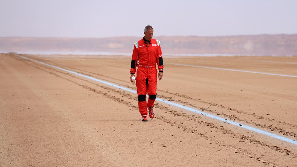 Andy Green inspects the track