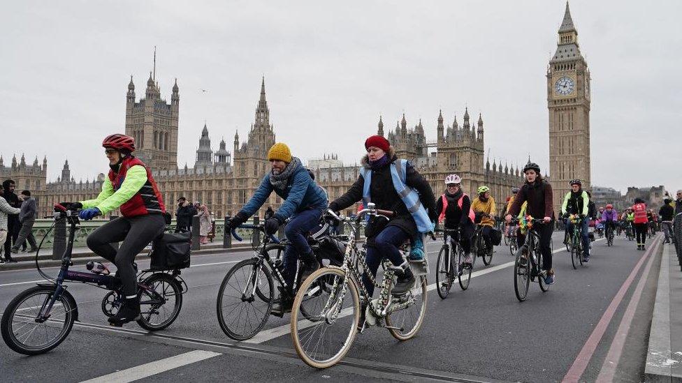 Protesters cycle through London