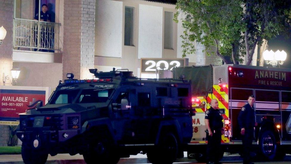 Police officers outside the building in Orange, California, on 31 March 2021