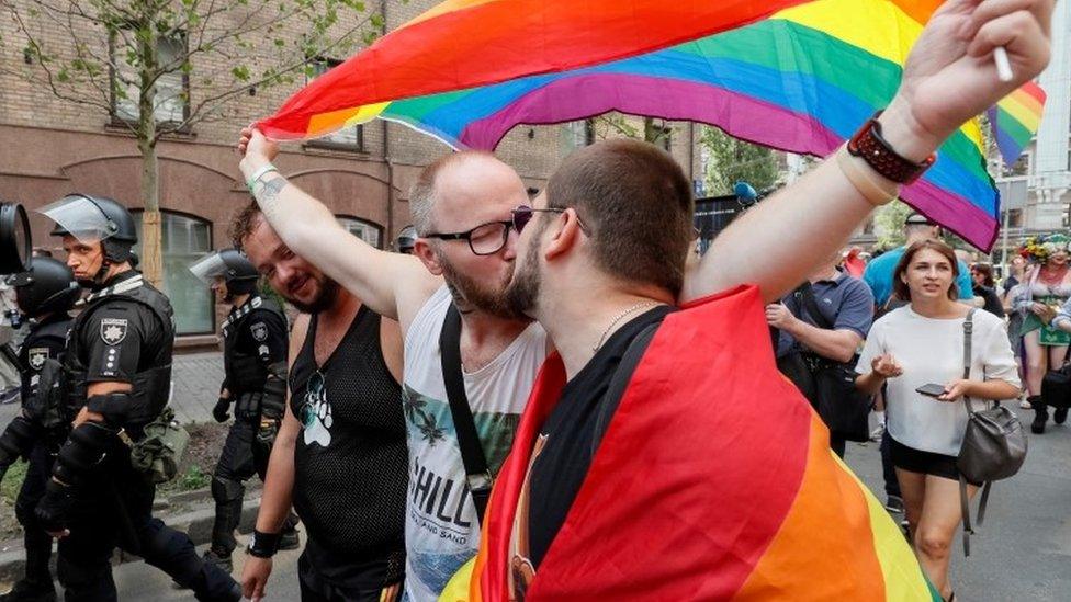 A couple kiss at Kiev Pride