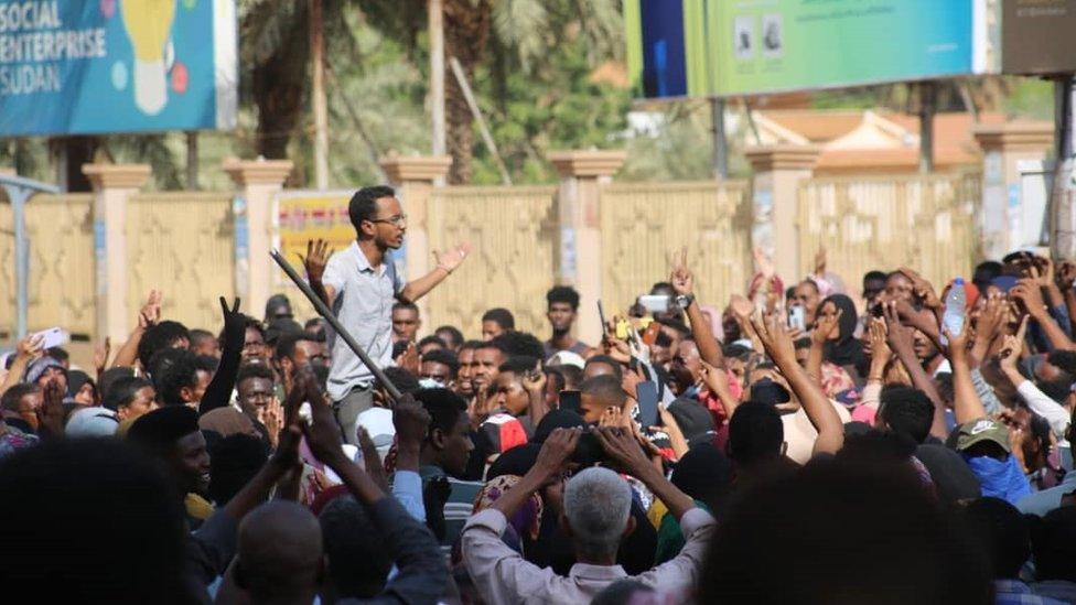 People protest near the army HQ in Khartoum