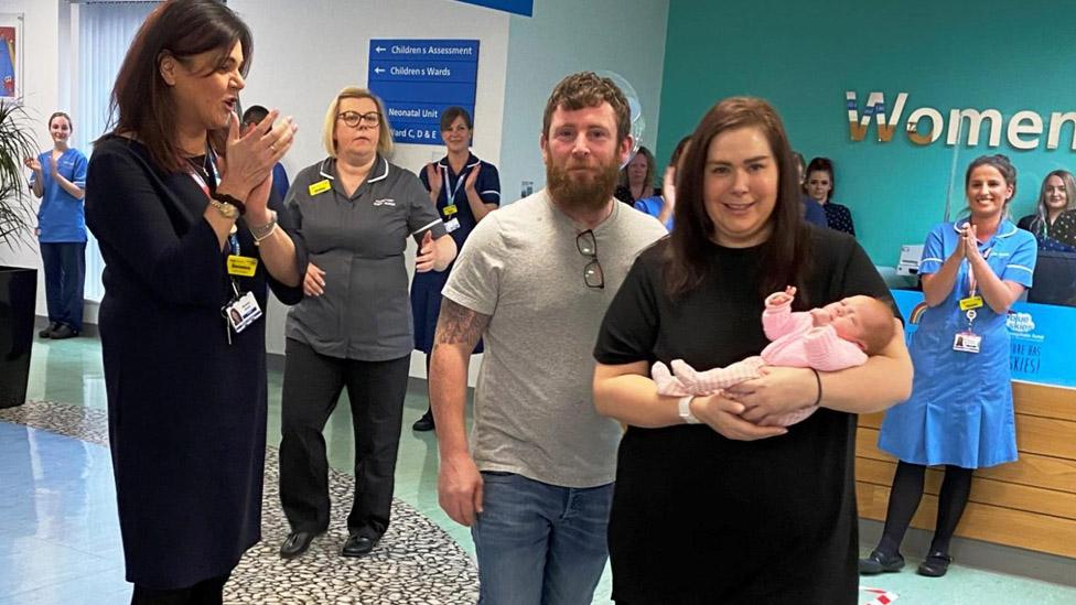 Stuart, Kathrine and Ruby Dawson leaving hospital