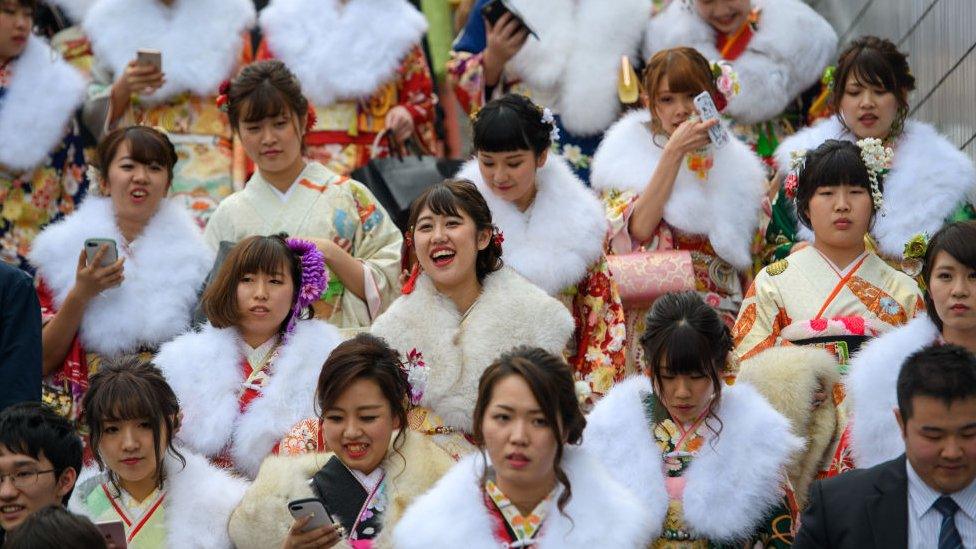 Women wearing kimonos leave after attending a Coming of Age ceremony on January 8, 2018 in Yokohama, Japan.