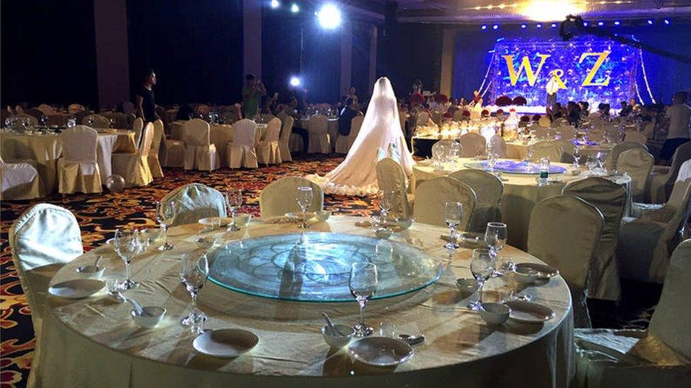 Flood-struck wedding, China.