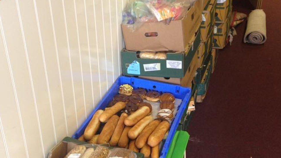 A box of bread and vegetables