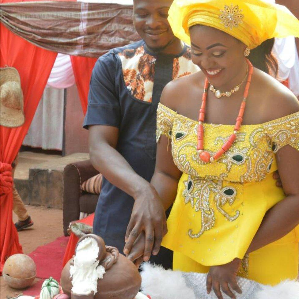 The happy couple cutting their cake