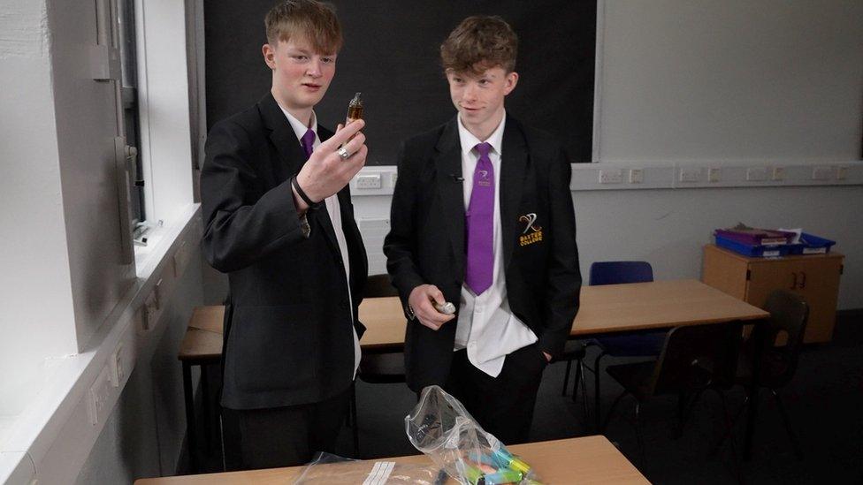 School pupil holding a vape