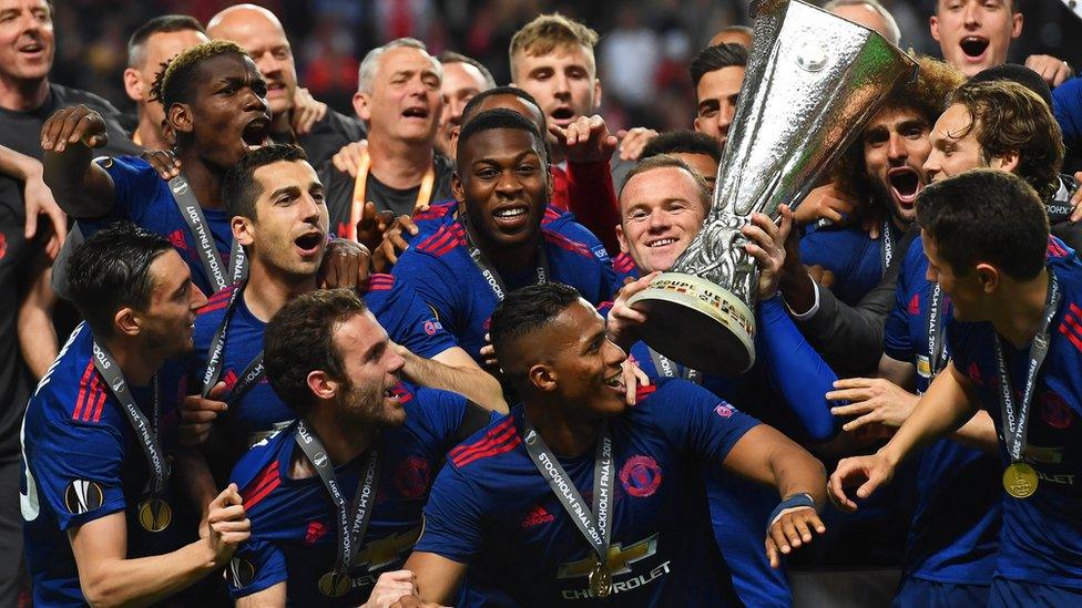 Manchester United with Europa League trophy