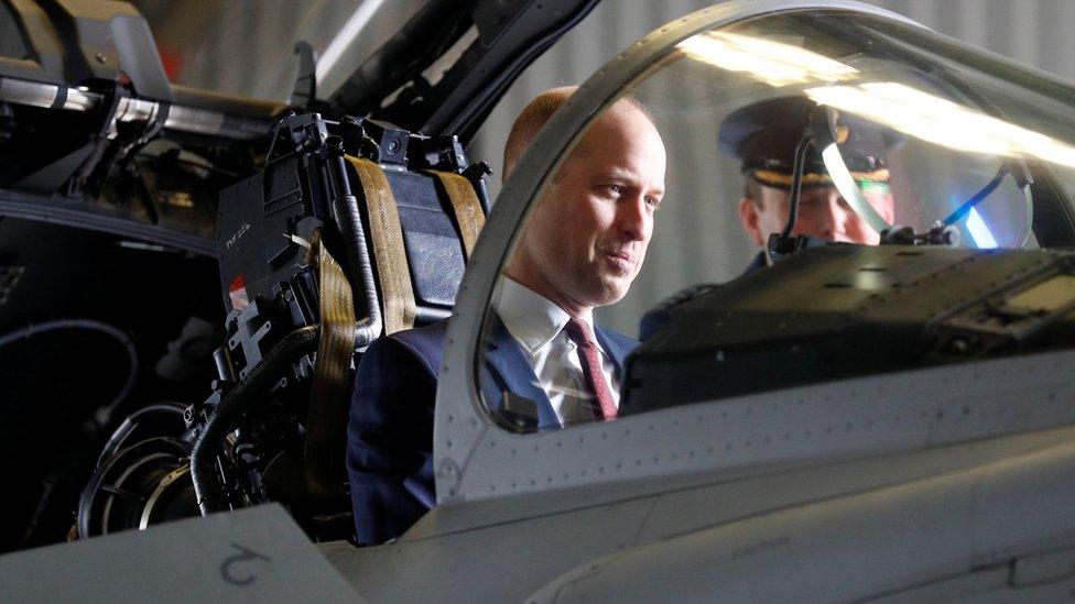 Prince William in the cockpit of a Eurofighter Typhoon jet during a visit to RAF Coningsby