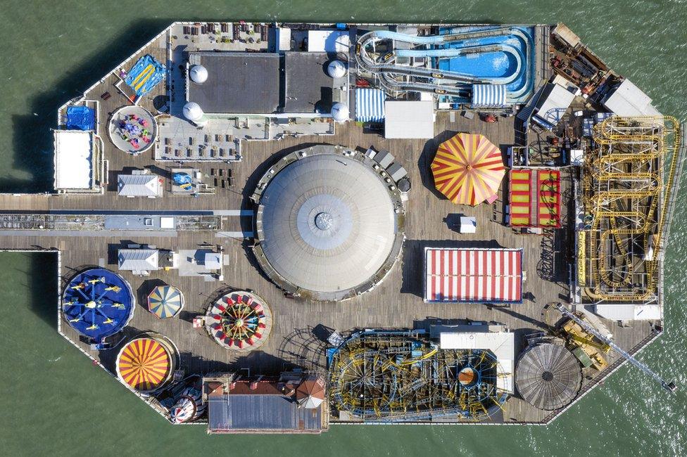 An aerial view of an empty Brighton pier