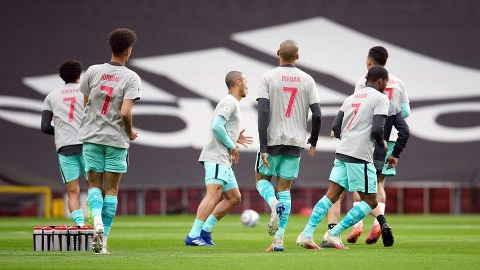 Liverpool players wearing shirts paying tribute to Jordan Banks